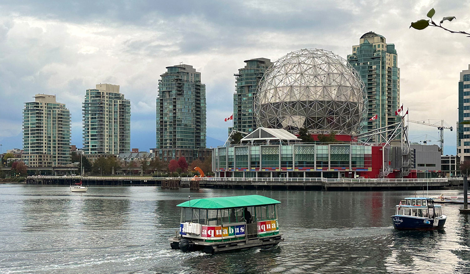 The Aquabus ferries passengers along False Creek near Science World – Vancouver, British Columbia – October 2022